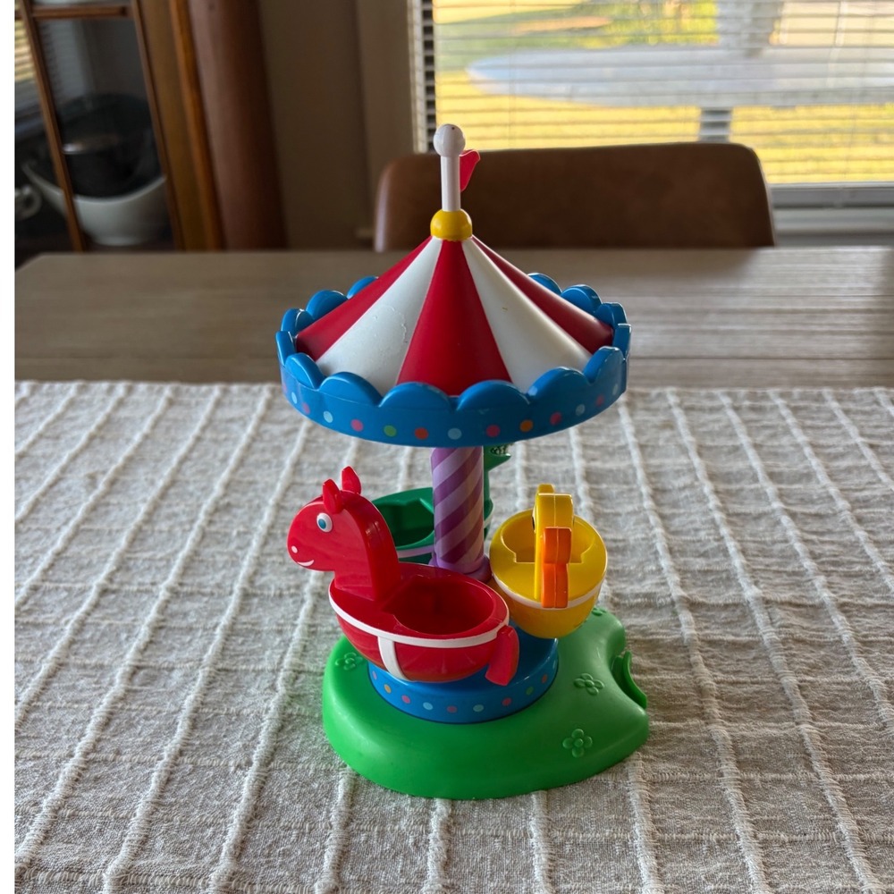 Peppa Pig Fun Fair Playset merry go round red and white striped canopy